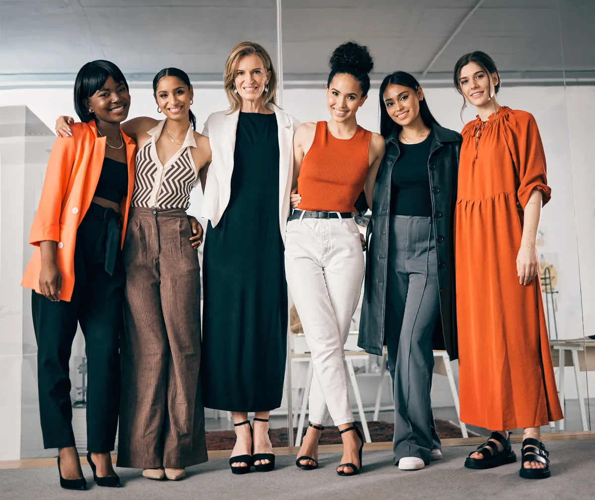 Women combining colourful tops with neutral trousers