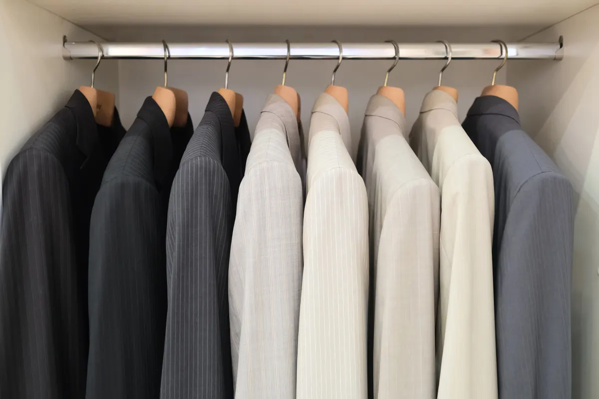 Neutral coats arranged neatly on matching hangers