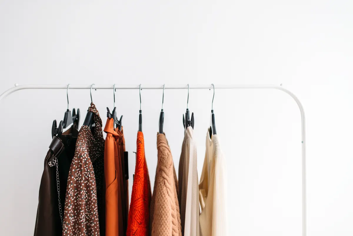 A compact rail of garments in varied colours and patterns