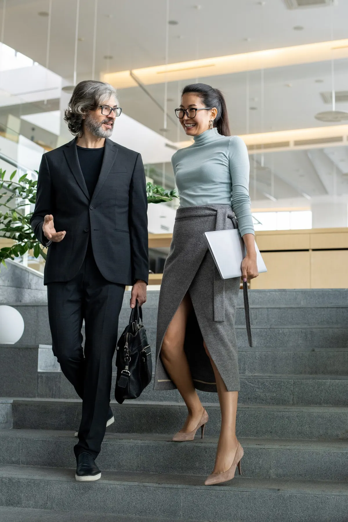 Women walking in tailored jackets and skirts