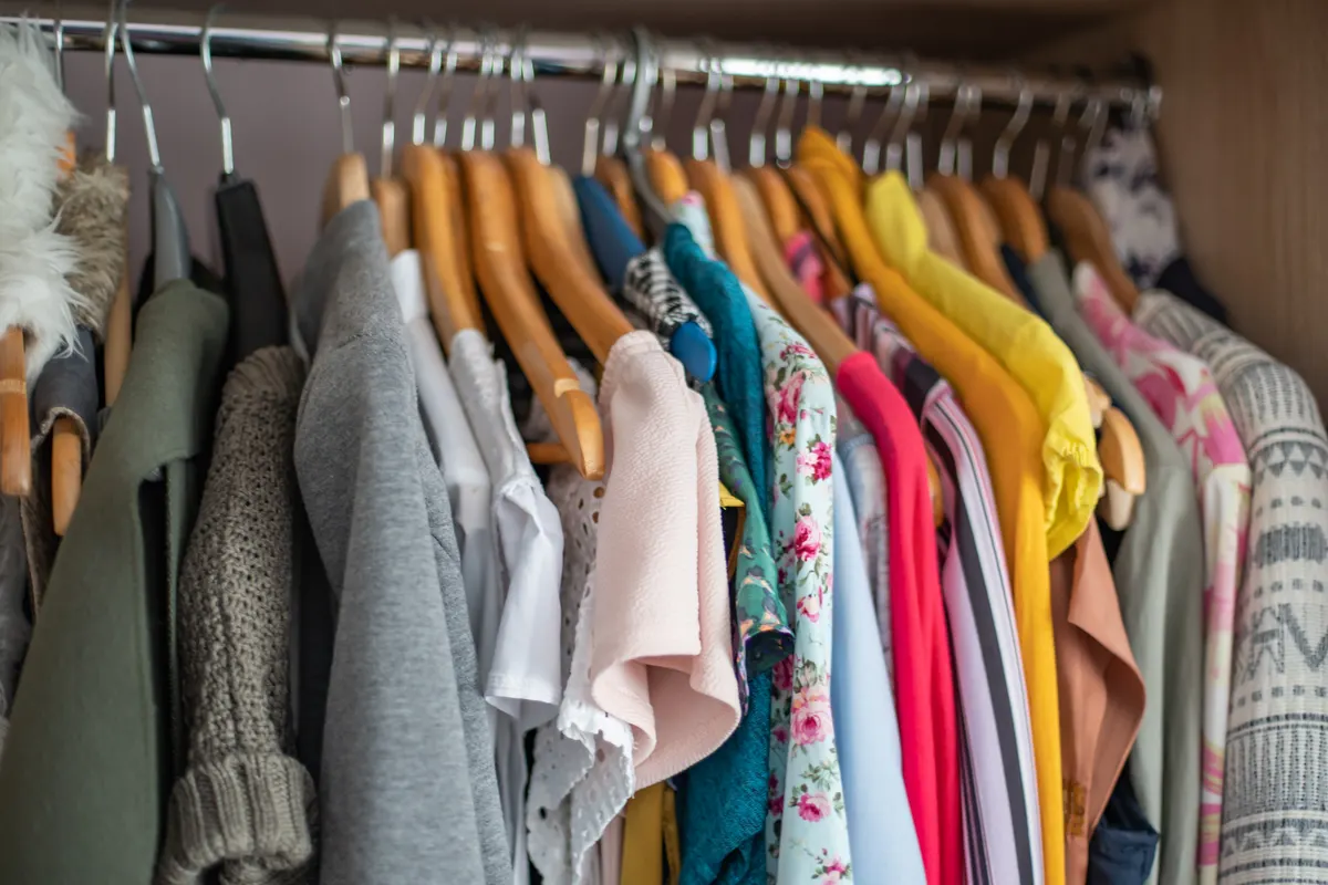 A clothing rail with coordinated colourful garments